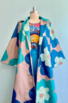 Tan Spring Coat with Large Blue Flowers
