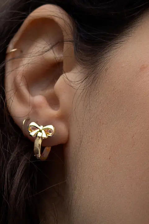 Bow and Tell Huggie Hoops Earrings by Peter and June