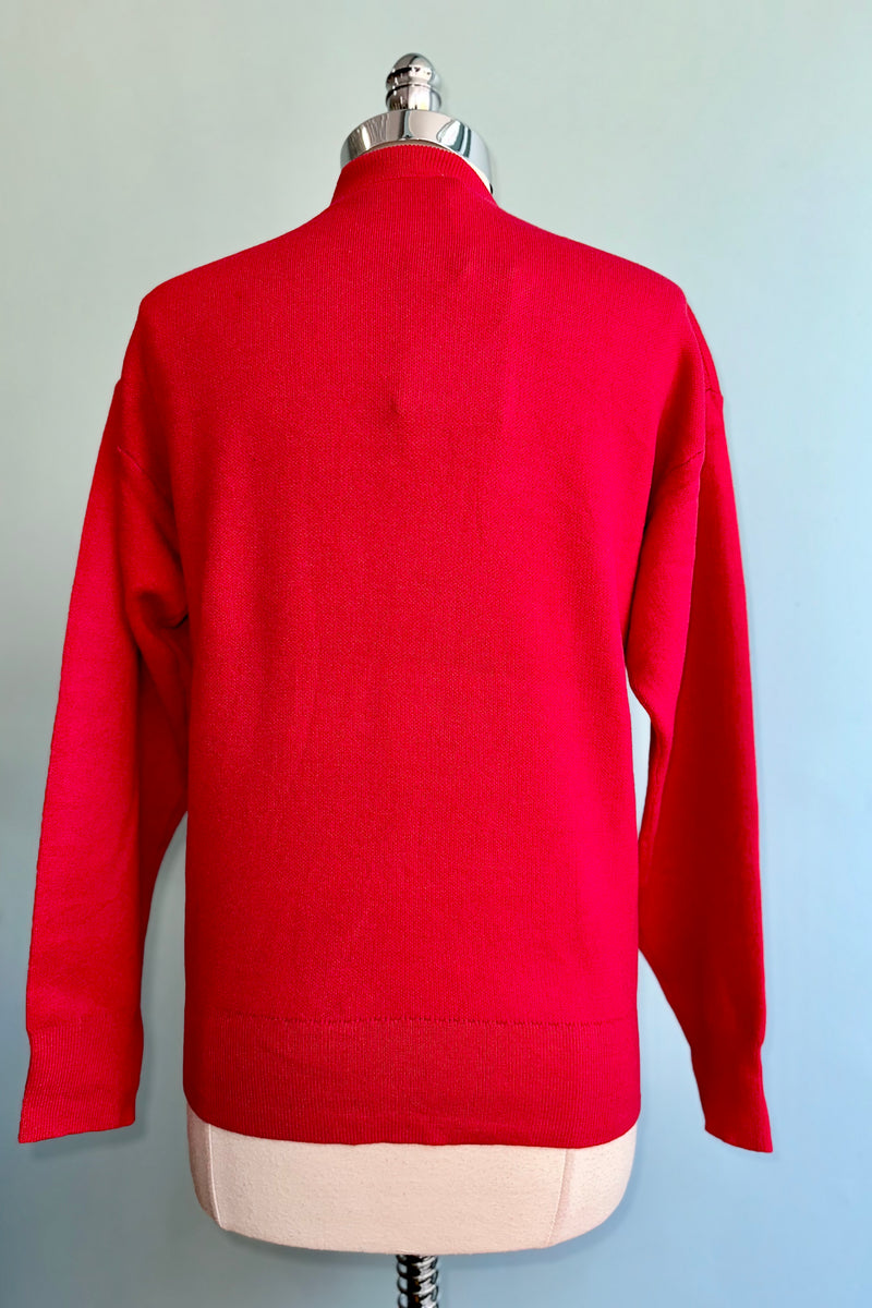 Large Burgundy Flower on a Red Sweater by Compania Fantastica
