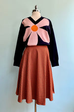 Large Pink Flower on a Navy Sweater by Compania Fantastica
