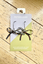 Silver Hot to Bow Earrings by Peter and June