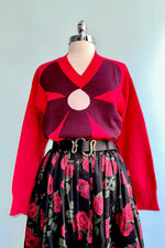 Large Burgundy Flower on a Red Sweater by Compania Fantastica