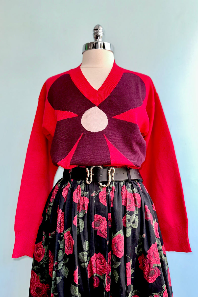 Large Burgundy Flower on a Red Sweater by Compania Fantastica