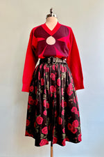 Large Burgundy Flower on a Red Sweater by Compania Fantastica