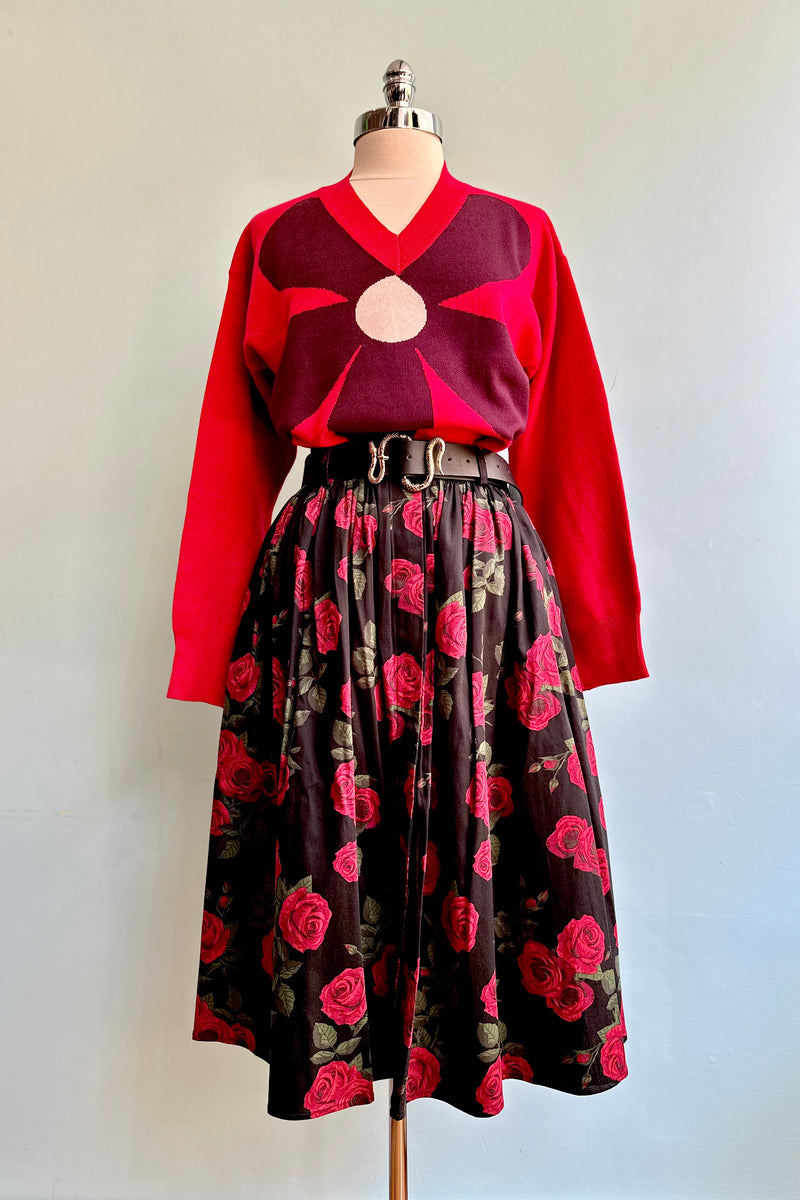 Large Burgundy Flower on a Red Sweater by Compania Fantastica