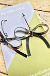 Silver Hot to Bow Earrings by Peter and June
