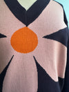 Large Pink Flower on a Navy Sweater by Compania Fantastica