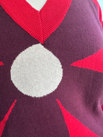 Large Burgundy Flower on a Red Sweater by Compania Fantastica