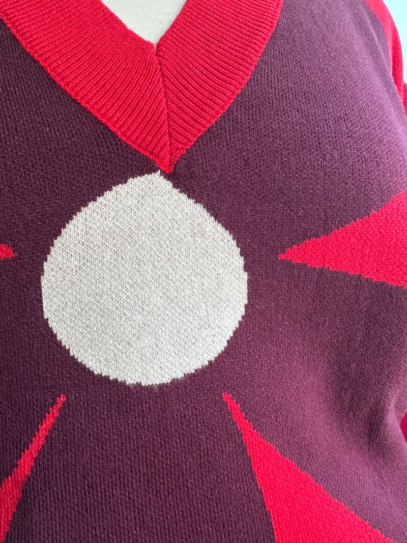 Large Burgundy Flower on a Red Sweater by Compania Fantastica