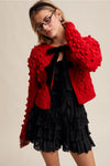 Red Pom Pom Cardigan with Black Velvet Bows